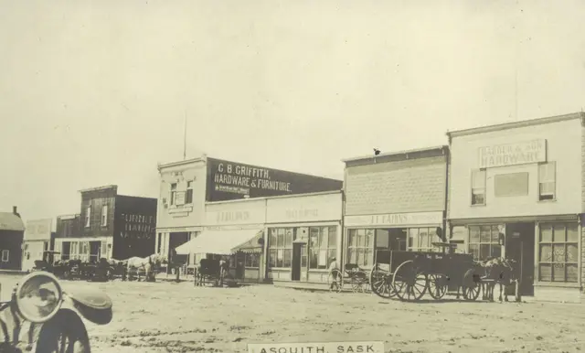 Main Street with hardware stores and wagons
