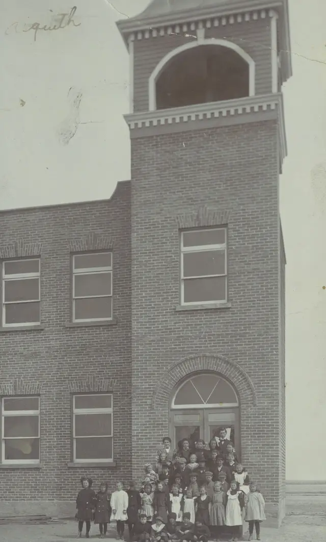 Students outside the brick school
